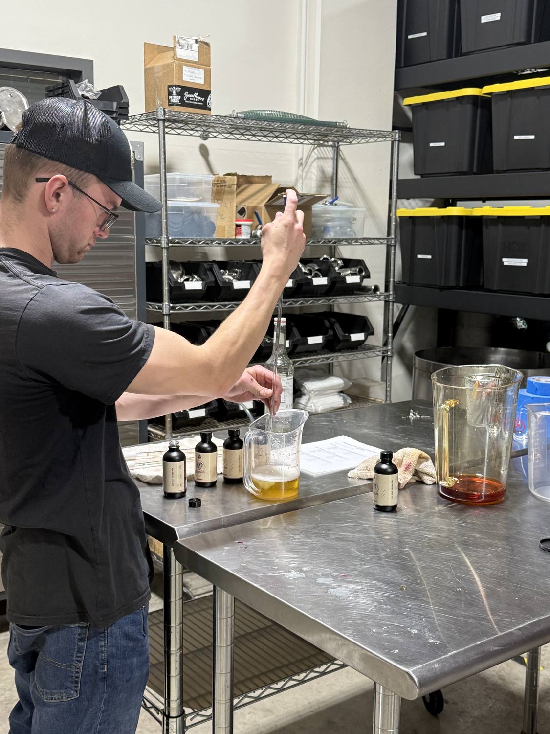 A glass of wine being sampled at Sweet Heart Winery, where Tesoro's pours are made