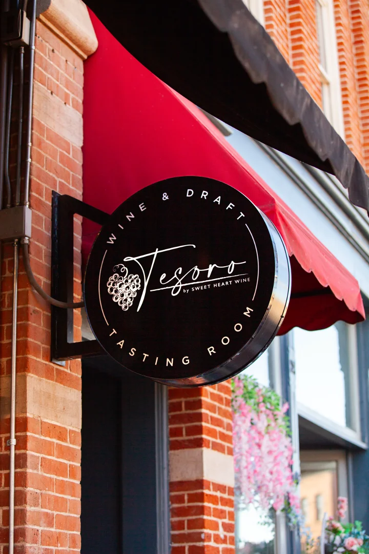 The Tesoro storefront sign in Old Town Fort Collins